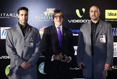 Bollywood's top star Amitach Bachchan, center, with two bodyguards before a fashion show one day before the 10th International Indian Film Awards presentation at a casino-hotel complex in Macau.