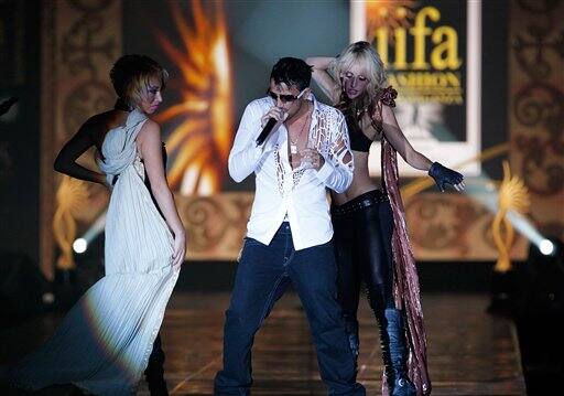 British singer Peter Andre performs at a fashion show, one day before the 10th International Indian Film Awards presentation, at a casino-hotel complex in Macau.