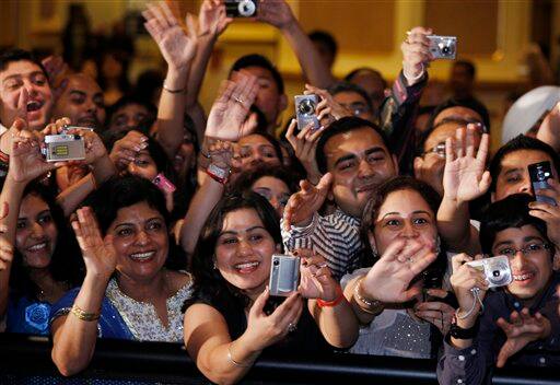 Fans cheer to movie star on the green carpet at the 10th International Indian Film Awards presentation at a casino-hotel complex in Macau