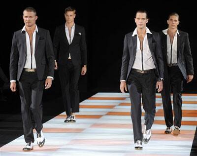 Models take the runway during the Emporio Armani Spring/Summer 2009/2010 men's collection, presented in Milan, Italy, Tuesday, June 23, 2009.