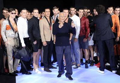 Giorgio Armani bows to the audience after presenting his Emporio Armani Spring/Summer 2009/2010 men's collection, in Milan, Italy, Tuesday, June 23, 2009.