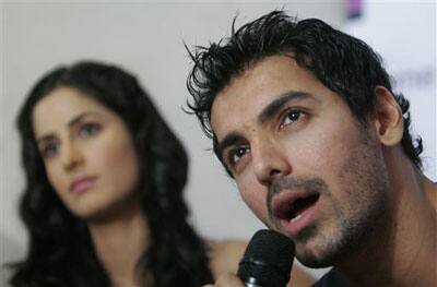 Bollywood actor John Abraham, right, speaks as actress Katrina Kaif looks on during a promotional event for their upcoming movie 