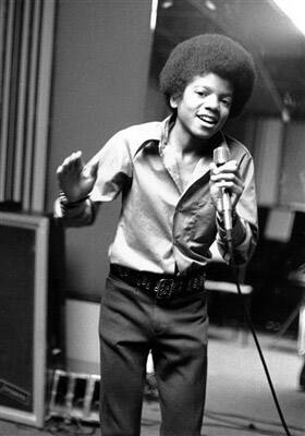 In this 1972 file photo, singer Michael Jackson at age 13, the youngest member of the singing group Jackson Five, sings in his home in Encino, Ca.