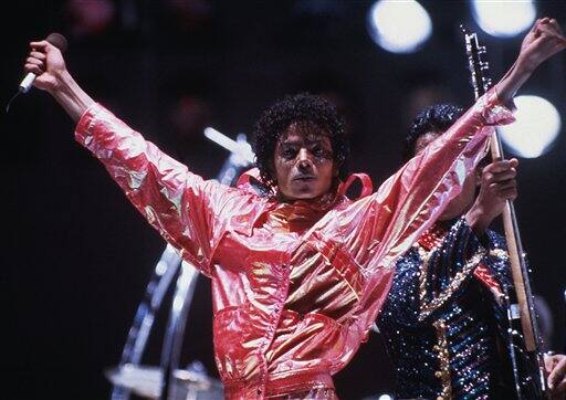 In this 1984 file picture, Michael Jackson poses on stage during the Jacksons' Victory Tour.