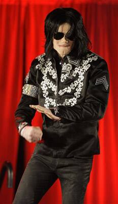 In this Thursday, March 5, 2009 file picture, Michael Jackson punches the air during a news conference in London's O2 Arena announcing that he is set to play ten live concerts in July.