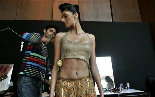 A model gets ready backstage before the start of a show at the Bangalore Fashion Week 2009, in Bangalore, India.