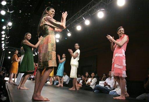 Models applaud designer Babita Jai Shankar, unseen, as they display her creations at the Bangalore Fashion Week 2009, in Bangalore, India, Sunday, July 26, 2009.