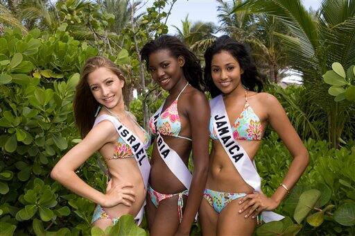 This undated photo provided Tuesday, Aug. 4, 2009 by the Miss Universe Organization shows Julia Dyment, Miss Israel 2009; Happie Ntelamo, Miss Namibia 2009, and Carolyn Yapp, Miss Jamaica 2009, posing