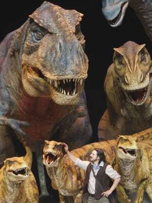 Walking with Dinosaurs: Model dinos get petted by Dominic Rickhards in the London show. 