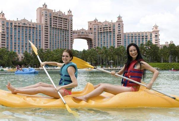 Michelle Rouillard (L), Miss Colombia 2009, and Wang Jingyao, Miss China 2009, kayak at Atlantis on Paradise Island ahead of the Miss Universe 2009 pageant in the Bahamas.