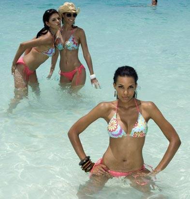 (L-R) Miss Ecuador Sandra Vinces, Miss Peru Karen Schwarz and Miss Dominican Republic Ada Aimee De la Cruz pose as they film a segment for the Miss Universe 2009 competition on Stocking Island.