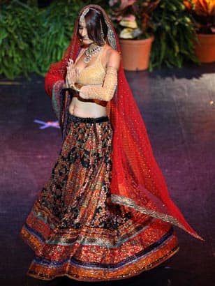 Miss India Ekta Chowdhry walks the runway during the national costume event of the Miss Universe 2009 competition in Nassau, Bahamas.