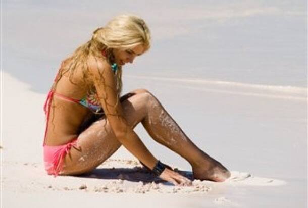 Kristina Kots-Gotlib, Miss Ukraine 2009, plays in the sand at Coral Sands Hotel in Harbour Island, Bahamas