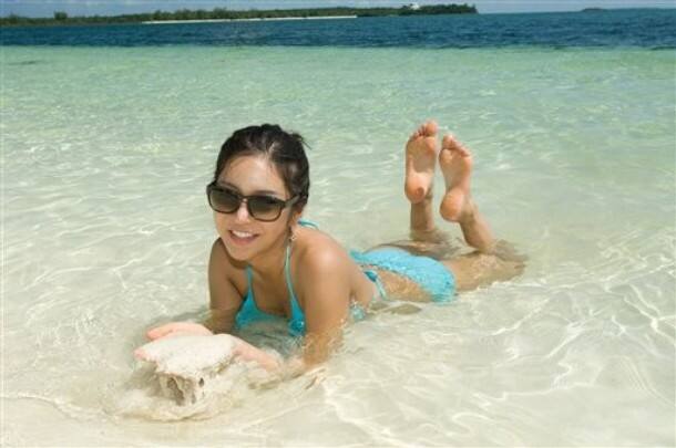 Nari , Miss Korea 2009, enjoys the water on Manjack Cay, Abaco, Bahamas on Tuesday, Aug, 11, 2009 during a day of filming for the Miss Universe 2009 competition.