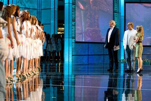 Donald Trump, left, Phil Ruffin, center, and Paula Shugart meet the Miss Universe 2009 contestants at the Imperial Ballroom at Atlantis, Paradise Island Bahamas