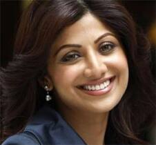 Shilpa Shetty smiles after announcing her involvement in the V8 Gourmet Group.