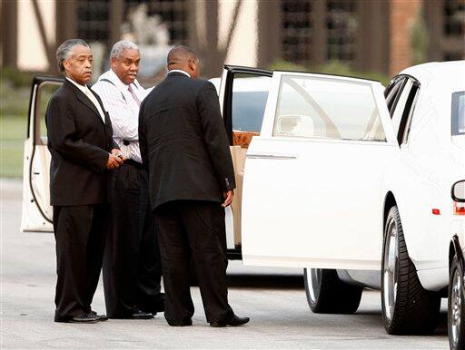 Rev. Al Sharpton, left, arrives to Michael Jackson's funeral at Forest Lawn Memorial Park in Glendale, Calif.