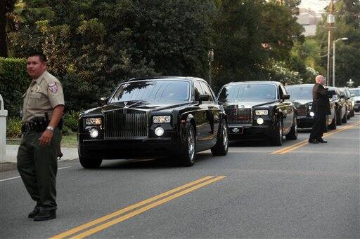 Rolls Royce limousines line the street in front of the Jackson family residence in the Encino section of Los Angeles waiting to take family members to Michael Jackson's funeral