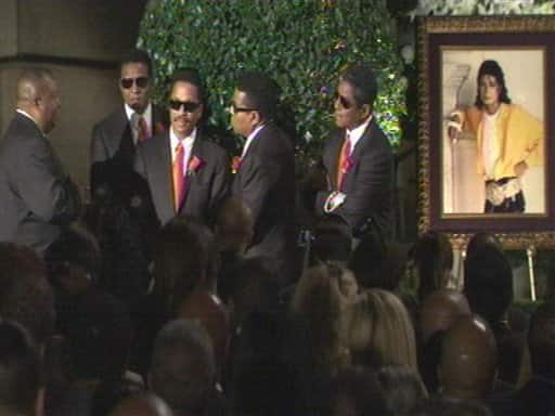 In this image made from video, from right, brothers Germaine, Tito, Marlon and Jackie Jackson attend their brother Michael Jackson's funeral at Forest Lawn Memorial Park in Glendale, Calif.