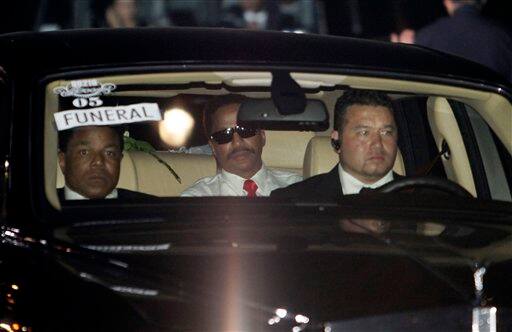 Marion Jackson, center, leaves at the conclusion of Michael Jackson's funeral at Forest Lawn Memorial Park in Glendale, Calif.