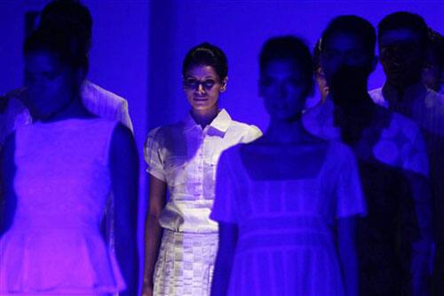 Models display outfits by designer Zubair Kirmani during the Kolkata Fashion Week in Calcutta