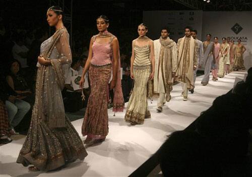 Models walk in ramp with outfits designed by Rocky S during Kolkata Fashion Week in Calcutta