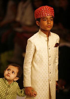 Children present creations by designer Himmat Singh at the Van Heusen India Men's Week 2009 in New Delhi.