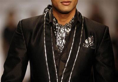 A model wears a creation by designer Manoviraj Khosla at the Van Heusen India Men's fashion week in New Delhi, India,