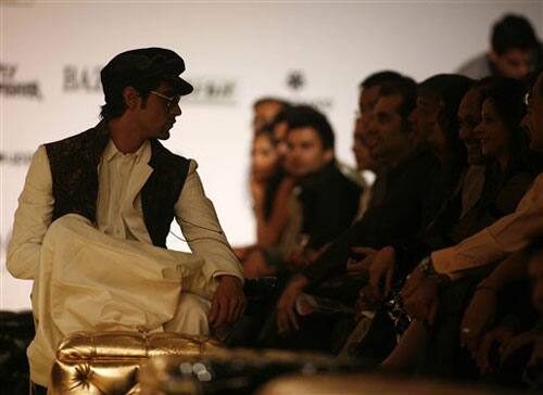 A model, left, displays a creation by designer Rohit Bal at the Van Heusen India Mens Week