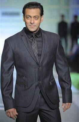 Bollywood actor Salman Khan displays a design by designers Rohit Gandhi & Rahul Khanna at the Van Huesen India Mens Week 2009 in New Delhi, India.