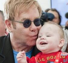 Elton John with Baby Lev at an orphanage in Ukraine.