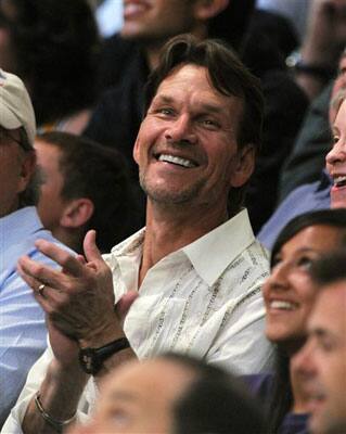 ctor Patrick Swayze watches the Los Angeles Lakers and San Antonio Spurs play in the first half in Game 2 of the NBA Western Conference basketball finals in Los Angeles.