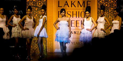 Bollywood actor Dia Mirza, center, along with other models, showcases the creations by designer Nishka Lulla on the first day of Lakme Fashion Week 2009 in Mumbai, India.