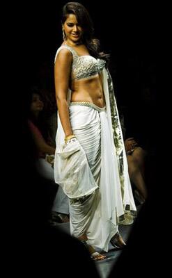 Indian actress Sameera Reddy showcases a creation by designer Neeta Lulla on the first day of the Lakme Fashion Week 2009 in Mumbai, India.