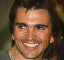 Colombian singer Juanes smiles during a news conference after arriving at the Hotel Nacional for the upcoming Peace Without Borders concert in Havana.