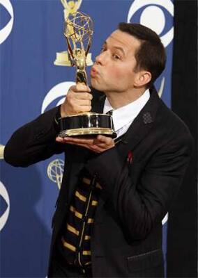 Jon Cryer with his award for best supporting actor in a comedy series at the Emmy Awards. 