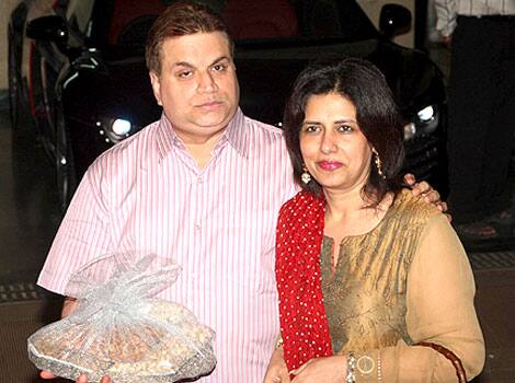 Bollywood producer Ramesh Taurani arrives with his wife for Mata ki chauki at the home of actor Sanjay Dutt on the occasion of Navratri in Mumbai.