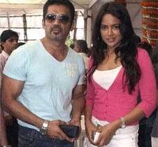 Sunil Shetty and Sameera Reddy pose for a picture at an exhibition in Mumbai.