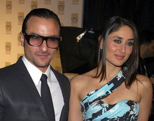 Bollywood actors Saif Ali Khan (L) and Kareena Kapoor pose for a photograph during the 