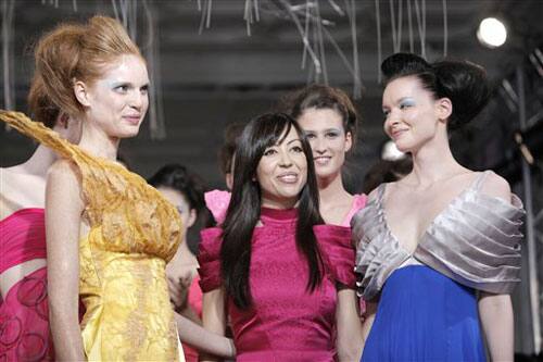 Portuguese fashion designer Fatima Lopes, center, acknowledges applause with her models at the end of her Ready to Wear Spring Summer 2010 fashion collection