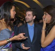 Mughda Godse speaks with Neil Nitin Mukesh as Priyanka Chopra smiles during the music launch ceremony of their forthcoming movie ‘Jail’ at a multiplex in Mumbai.