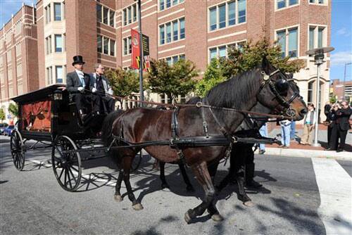 An antique hearse makes its way to Westminster Hall in Baltimore during a reenactment of author Edgar Allan Poe's funeral