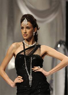 A model displays jewellery created by Indian designer Maheep Kapoor on the first day of the HDIL India Couture Week on September 12, 2009 in Mumbai. 