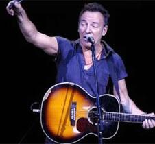 Musician Bruce Springsteen walks on stage to perform in a benefit concert for 'Autism Speaks' in New York.