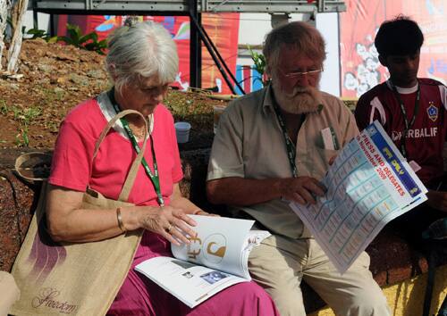 Foreign delegates going through the festival brochure at the 40th International Film Festival (IFFI-2009), in Panaji, Goa on November 24, 2009.