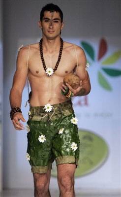 A model showcases a creation made of leaves and flowers by designer Hugo Alberto Puentes during the Bio Fashion show in Colombia.