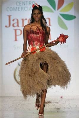 A model showcases a creation made of leaves and flowers by designer Angelica Fernandez during the Bio Fashion show in Colombia.