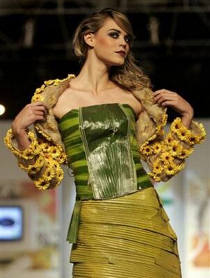 A model showcases a creation made of leaves and flowers by designer Angela Aponte during the Bio Fashion show in Colombia.