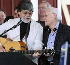 Country music legends Randy Owen, left, and George Jones perform the song, 'My Home's in Alabama,' at the grand opening of Country Crossing in Dothan.