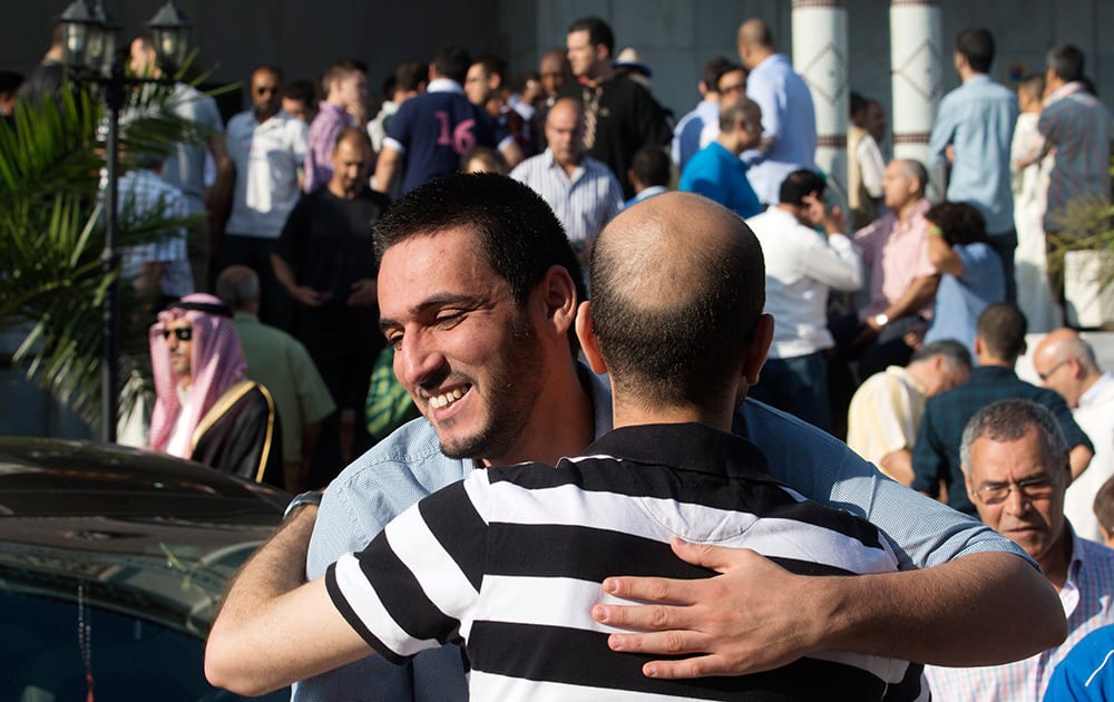 Muslims celebrate after a prayer session marking Eid al-Fitr the end of the Muslim holy fasting month of Ramadan at the Mosque and Islamic Cultural Center in Madrid.